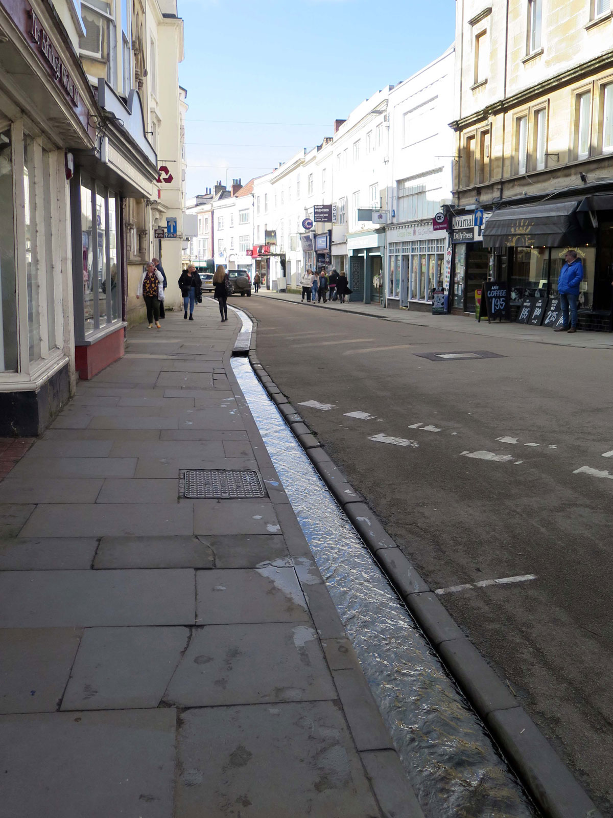 04-Water-from-the-Springs-running-down-a-conduit-in-Market-Place-towards-the-High-Street