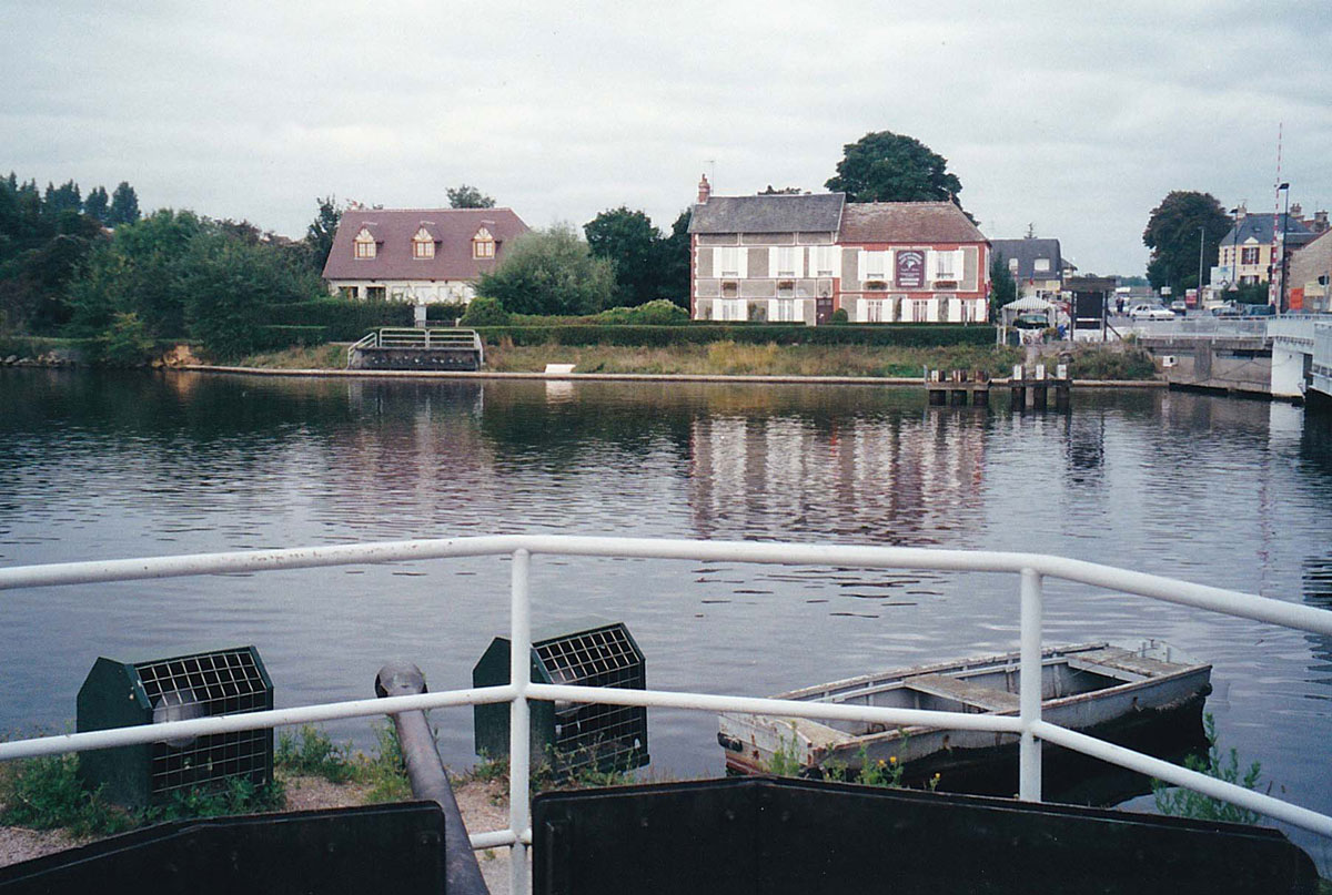09-Cafe-Gondree-from-across-the-Caen-Canal-(Note-the-Gun-Emplacement-in-the-foreground)
